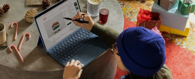 Woman shoppping online for holiday gifts. 