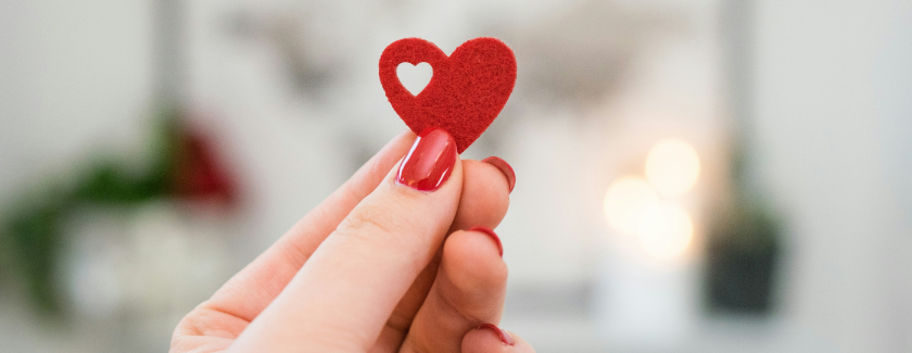 Hand holding up a heart